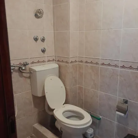 Vendégház In *